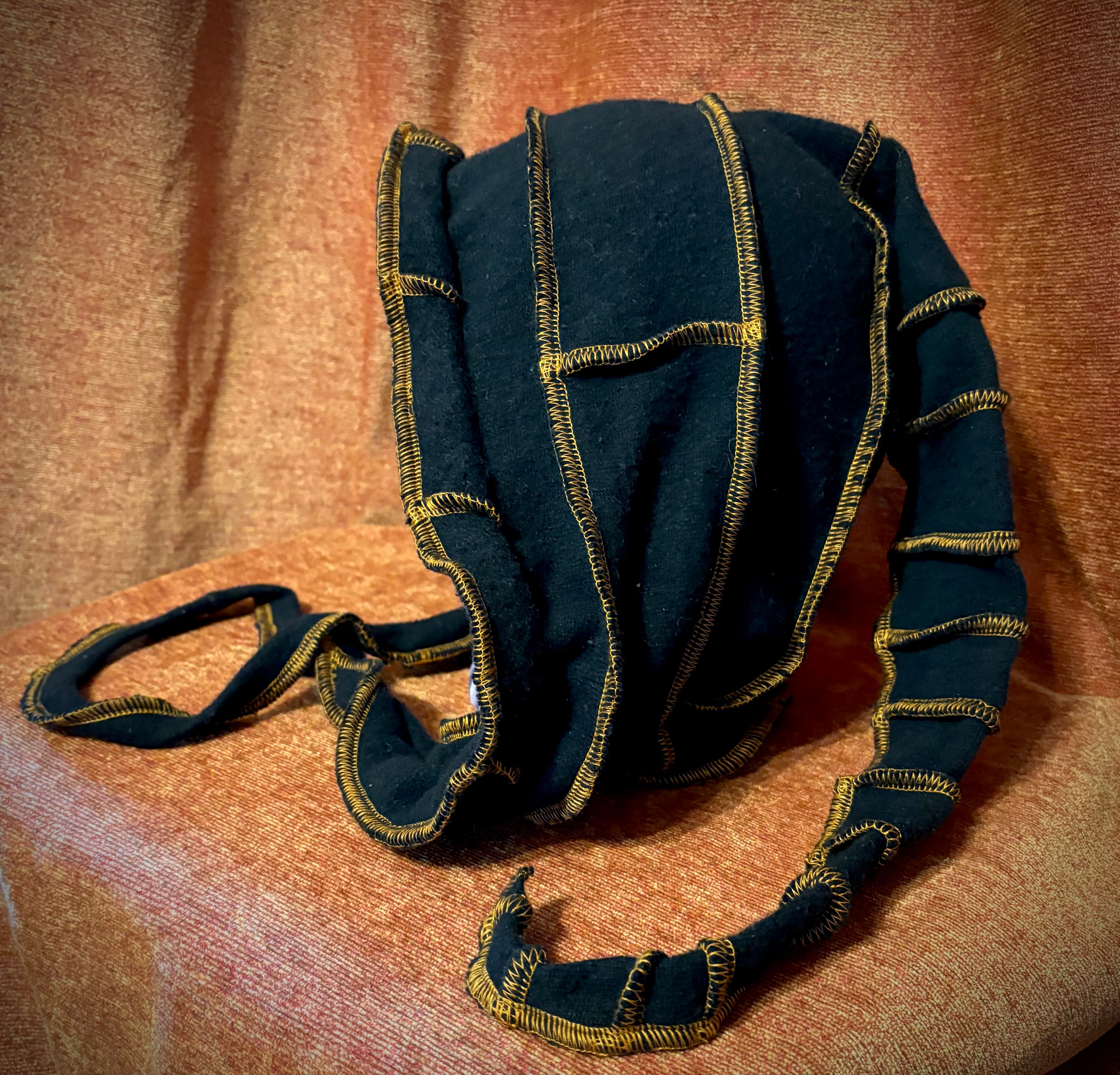 Black cashmere hood with copper thread accents