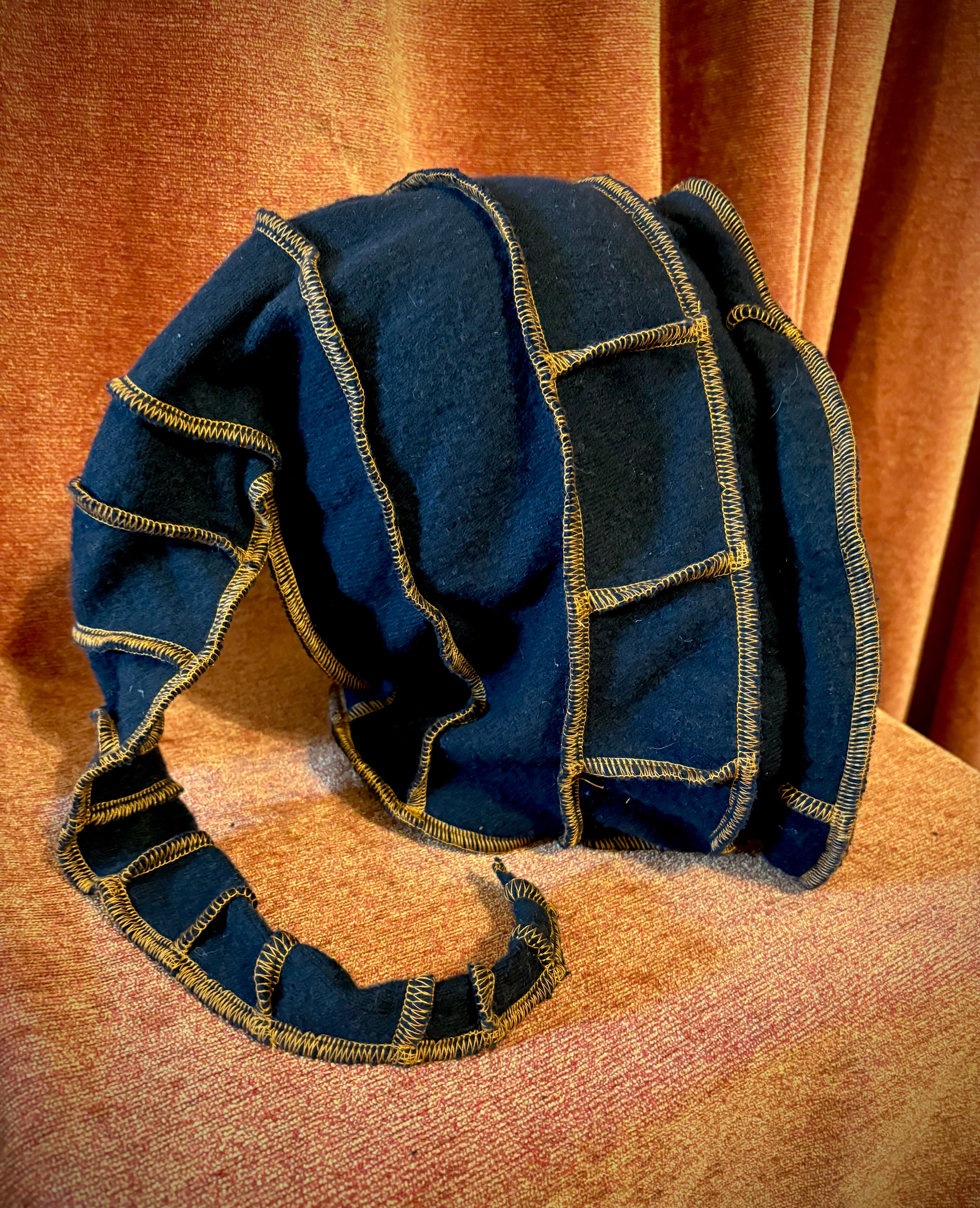 Black cashmere hood with copper thread accents